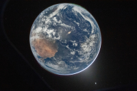 Picture of Earth from the Orion spacecraft's window on April 2, 2026, after completing the translunar injection burn. Image Credit: NASA/Reid Wiseman